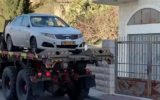 Israeli security forces seize a car in the West Bank town of Beit Jala that was used in a car-ramming attack against a group of IDF soldiers in Jerusalem earlier in the day on February 6, 2020. (Screen capture)
