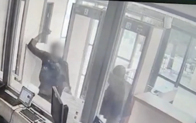 A Palestinian man wielding a knife tries to stab an Israeli Border Police officer in a security post in Hebron on February 16, 2020. (Screen capture/Israel Police) A Palestinian man wielding a knife tries to stab an Israeli Border Police officer in a security post in Hebron on February 16, 2020. (Screen capture/Israel Police)