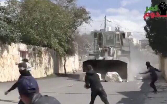 An IDF bulldozer is seen during clashes in the northern West Bank village of Kafr Qaddum on February 21, 2019. (Screen capture: Twitter) An IDF bulldozer is seen during clashes in the northern West Bank village of Kafr Qaddum on February 21, 2019. (Screen capture: Twitter)