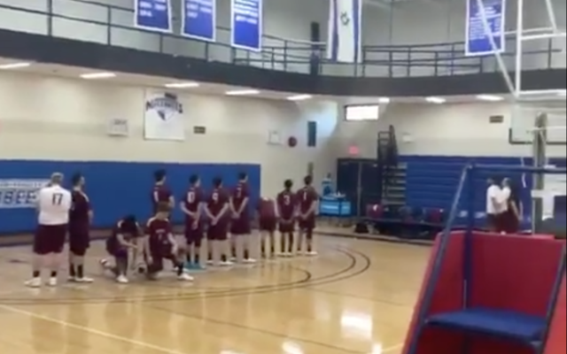 Volleyball players from Brooklyn College take a knee during the playing of Israel’s national anthem before a match at Yeshiva University (video screenshot) Volleyball players from Brooklyn College take a knee during the playing of Israel’s national anthem before a match at Yeshiva University (video screenshot)
