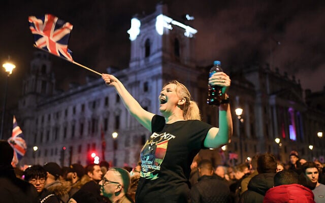 A Brexit supporter celebrates during a rally in Parliament square in London, England, Jan. 31, 2020. (AP Photo/Alberto Pezzali) A Brexit supporter celebrates during a rally in Parliament square in London, England, Jan. 31, 2020. (AP Photo/Alberto Pezzali)