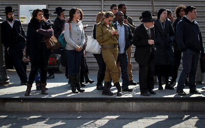 Israelis wait for a train in Jerusalem, February 17, 2014. (Hadas Parush/Flash90)