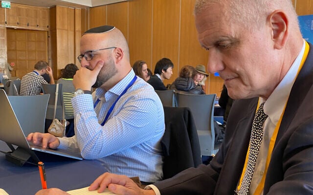 Will Irwin, right, at an OurCrowd conference in Jerusalem writing his name, February 13, 2020. (Shoshanna Solomon/Times of Israel) Will Irwin, right, at an OurCrowd conference in Jerusalem writing his name, February 13, 2020. (Shoshanna Solomon/Times of Israel)