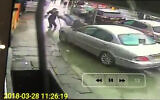A rabbi accidentally plows a Jaguar into two pedestrians on a London sidewalk, March 2018. (Screenshot)