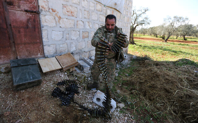 Turkish backed rebel fighters prepare for an attack near the village of Neirab in Idlib province, Syria, Feb. 20, 2020. (AP Photo/Ghaith Alsayed) Turkish backed rebel fighters prepare for an attack near the village of Neirab in Idlib province, Syria, Feb. 20, 2020. (AP Photo/Ghaith Alsayed)