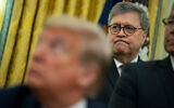 US Attorney General William Barr listens as President Donald Trump speaks at the White House, November 26, 2019, in Washington. (AP Photo/ Evan Vucci)