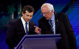 Democratic presidential candidates Pete Buttigieg, left and Bernie Sanders, right, talk during a break during a primary debate in Houston, Texas, Sept. 12, 2019. (AP/David J. Phillip)