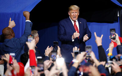 US President Donald Trump walks onstage at a campaign rally, in North Charleston, South Carolina, February 28, 2020. (AP/Patrick Semansky)