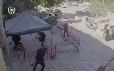 An Arab Israeli man opens fire on police officers in Jerusalem in footage published by police, February 6, 2020. (Screenshot/Israel police)