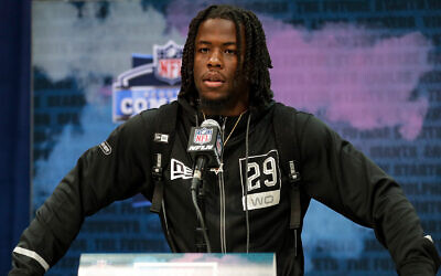 Alabama wide receiver Jerry Jeudy speaks during a press conference at the NFL football scouting combine in Indianapolis, Feb. 25, 2020. (AP Photo/Michael Conroy)