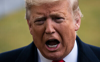 US President Donald Trump speaks to reporters before boarding Marine One at the White House in Washington, Feb. 7, 2020. (AP Photo/J. Scott Applewhite)