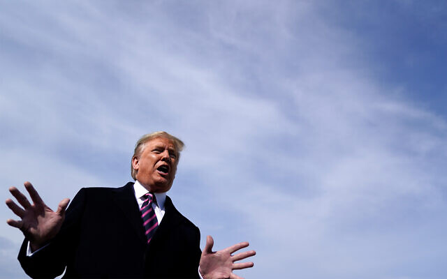 US President Donald Trump talks to the media before he boards Air Force One for a trip to Los Angeles to attend a campaign fundraiser, Feb. 18, 2020, at Andrews Air Force Base, Maryland. (AP Photo/Evan Vucci) US President Donald Trump talks to the media before he boards Air Force One for a trip to Los Angeles to attend a campaign fundraiser, Feb. 18, 2020, at Andrews Air Force Base, Maryland. (AP Photo/Evan Vucci)