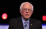 Democratic presidential candidate Sen. Bernie Sanders (I-VT) arrives on stage for the Democratic presidential primary debate at the Charleston Gaillard Center in Charleston, South Carolina, February 25, 2020. (Scott Olson/Getty Images/AFP)