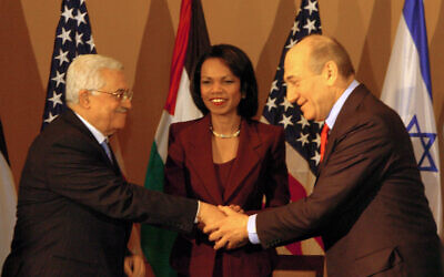 United States Secretary of State Condoleezza Rice, center, gestures to Israeli Prime Minister Ehud Olmert, right, and Palestinian Authority President Mahmoud Abbas, left, at a meeting at a hotel in Jerusalem, on February 19, 2007. (Flash90) United States Secretary of State Condoleezza Rice, center, gestures to Israeli Prime Minister Ehud Olmert, right, and Palestinian Authority President Mahmoud Abbas, left, at a meeting at a hotel in Jerusalem, on February 19, 2007. (Flash90)