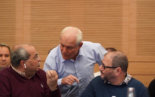 MK Haim Katz (C) talking to MKs Ahmed Tibi (L) and Ofer Kassif during a hearing of the Knesset House Committee on Katz's request for parliamentary immunity from corruption charges, February 4, 2020. (Adina Velman/Knesset) MK Haim Katz (C) talking to MKs Ahmed Tibi (L) and Ofer Kassif during a hearing of the Knesset House Committee on Katz's request for parliamentary immunity from corruption charges, February 4, 2020. (Adina Velman/Knesset)
