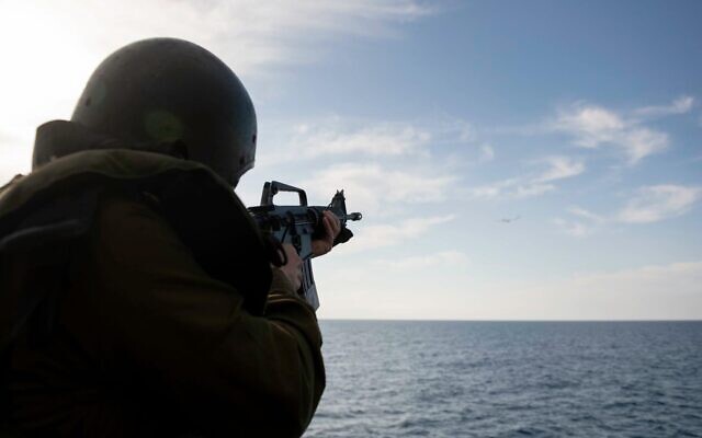 An Israeli sailor aims a rifle during a naval exercise off Israel's northern coast in February 2020. (Israel Defense Forces)