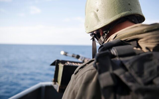 An Israeli sailor prepares to fire a machine gun during a naval exercise off Israel's northern coast in February 2020. (Israel Defense Forces)