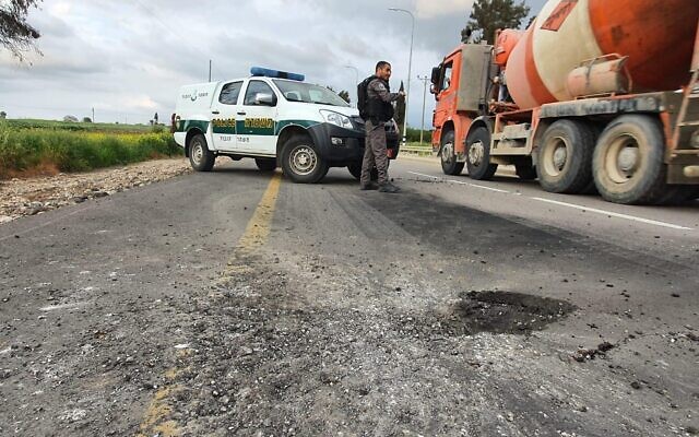 A mortar shell fired from the Gaza Strip causes damage to a road in southern Israel on February 23, 2020. (Israel Police) A mortar shell fired from the Gaza Strip causes damage to a road in southern Israel on February 23, 2020. (Israel Police)