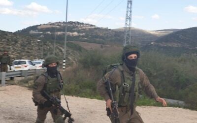 Israeli troops search for a gunman who opened fire at an IDF soldier, lightly injuring him, near the central West Bank settlement of Dolev on February 6, 2020. (Israel Defense Forces)
