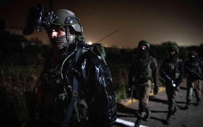 Israeli troops search for a Palestinian gunman who opened fire at IDF soldiers, injuring one of them, in the central West Bank, in February 2020. (Israel Defense Forces)