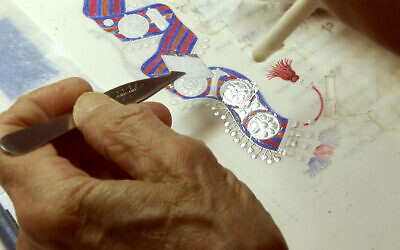 'Illuminated Book of Ruth' artist Barbara Wolff applies silver leaf to the manuscript. (Courtesy)