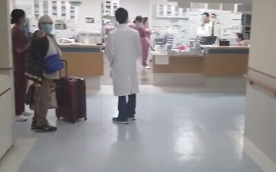 Rachel Biton is released from a Japanese medical facility after testing negative for coronavirus, February 25, 2020 (Screen grab/Channel 12 news)