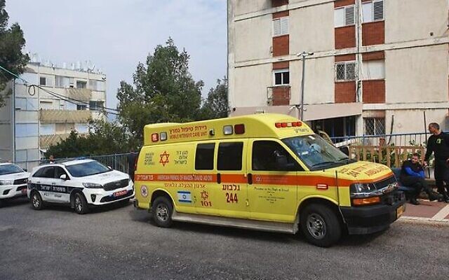Emergency services outside a building in Afula where a mother and daughter were found dead, February 18, 2020. (Magen David Adom) Emergency services outside a building in Afula where a mother and daughter were found dead, February 18, 2020. (Magen David Adom)