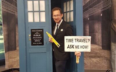 Gideon Marcus poses in front of a 'Dr. Who' telephone booth. (Courtesy)