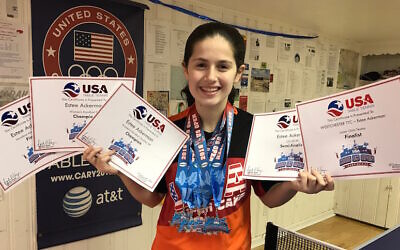 File: Estee Ackerman holding certificates representing the five medals she won in this month's US Open in table tennis (Courtesy of Estee Ackerman)