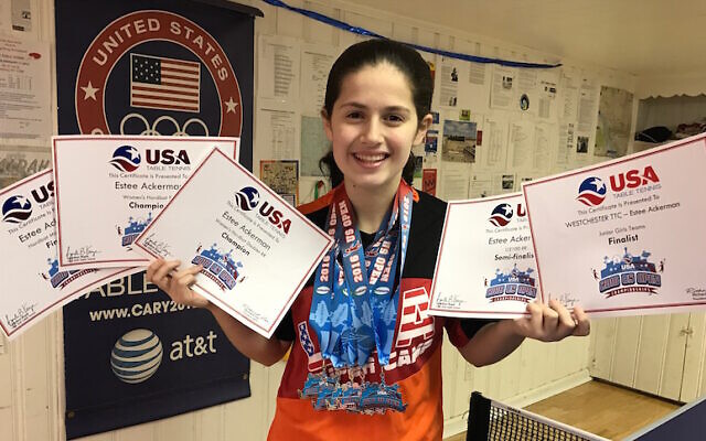 File: Estee Ackerman holding certificates representing the five medals she won in this month's US Open in table tennis (Courtesy of Estee Ackerman) File: Estee Ackerman holding certificates representing the five medals she won in this month's US Open in table tennis (Courtesy of Estee Ackerman)