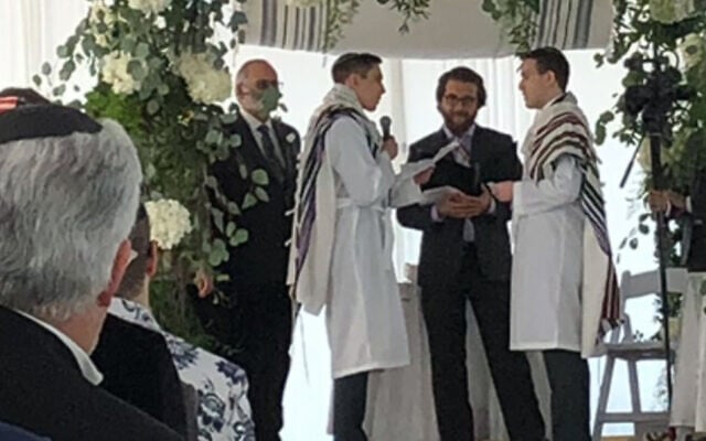Rabbi Avram Mlotek, center, performs his first same-sex wedding, February 2020. (Courtesy of Mlotek via JTA) Rabbi Avram Mlotek, center, performs his first same-sex wedding, February 2020. (Courtesy of Mlotek via JTA)