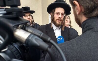 Joseph Gluck speaks to reporters the day after witnessing the attack at a rabbi's home in Monsey, New York, on December 29, 2019, (Ben Sales/JTA)