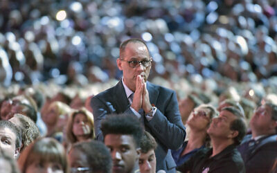 Fred Guttenberg watches a monitor honoring the 17 students and teachers who were killed at Marjory Stoneman Douglas High School, during a CNN town hall meeting in Sunrise, Florida, February 21, 2018. (Michael Laughlin/Sun Sentinel/TNS via Getty Images via JTA)