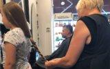 Eden had her braid measured to see if it was long enough to donate at Ophir Hashmonai's salon in Jerusalem (Jessica Steinberg/Times of Israel)