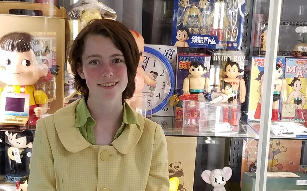 Lorelei Marcus in front of a display case full of collectibles. (Courtesy) Lorelei Marcus in front of a display case full of collectibles. (Courtesy)