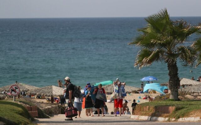 Israelis enjoy the Palmachim beach in southern Israel, October 21, 2016. (Nati Shohat/Flash90) Israelis enjoy the Palmachim beach in southern Israel, October 21, 2016. (Nati Shohat/Flash90)