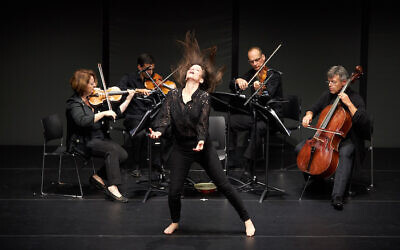 Renana Raz onstage performing one of her works (Courtesy Winnie Yeung)