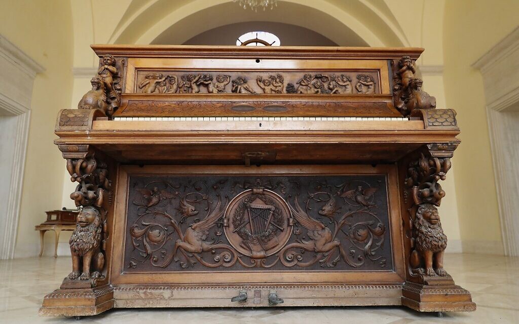 Carvings adorning the Piano of Siena, a 19th century instrument that disappeared for decades and was expected to fetch more than $1 million when put up for auction, seen in a home in the Israeli coastal city of Caesarea, February 18, 2020. (JACK GUEZ / AFP)