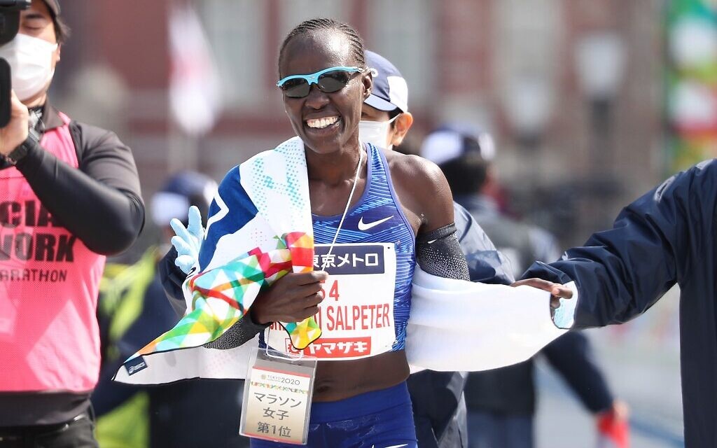 Lona Chemtai Salpeter of Israel reacts after crossing the finish line to win the women's category of the Tokyo Marathon in Tokyo on March 1, 2020. (Du Xiaoyi / POOL / AFP)