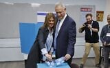 Blue and White party chief Benny Gantz and his wife Revital vote at a polling station in the city of Rosh Ha'ayin during parliamentary election on March 2, 2020 (Jack GUEZ / AFP)