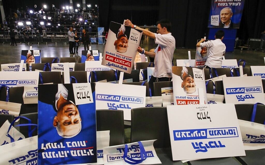 Volunteers sort election posters bearing the portrait of Prime Minister Benjamin Netanyahu, at the Likud party's electoral campaign headquarters in Tel Aviv on March 2, 2020. (Jack Guez/AFP) Volunteers sort election posters bearing the portrait of Prime Minister Benjamin Netanyahu, at the Likud party's electoral campaign headquarters in Tel Aviv on March 2, 2020. (Jack Guez/AFP)
