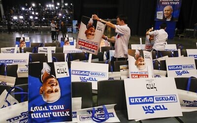 Volunteers sort election posters bearing the portrait of Prime Minister Benjamin Netanyahu, at the Likud party's electoral campaign headquarters in Tel Aviv on March 2, 2020. (Jack Guez/AFP) Volunteers sort election posters bearing the portrait of Prime Minister Benjamin Netanyahu, at the Likud party's electoral campaign headquarters in Tel Aviv on March 2, 2020. (Jack Guez/AFP)