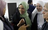 Iman Khatib-Yassin (center), an Arab Israeli newly elected to the Knesset, speaks to supporters in the northern town of Kafr Kanna on March 4, 2020 (AHMAD GHARABLI / AFP)