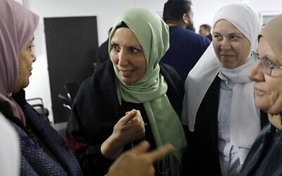 Iman Khatib-Yassin (center), an Arab Israeli newly elected to the Knesset, speaks to supporters in the northern town of Kafr Kanna on March 4, 2020 (AHMAD GHARABLI / AFP)