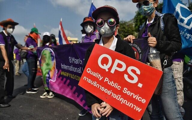 Members of Thai labour rights groups and state enterprise unions march for labour rights on International Women's Day in Bangkok on March 8, 2020. (Lillian SUWANRUMPHA / AFP) Members of Thai labour rights groups and state enterprise unions march for labour rights on International Women's Day in Bangkok on March 8, 2020. (Lillian SUWANRUMPHA / AFP)