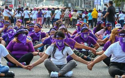 Filipino women hold a protest rally during the celebration of International Women's Day in Manila on March 8, 2020. (Maria TAN / AFP)