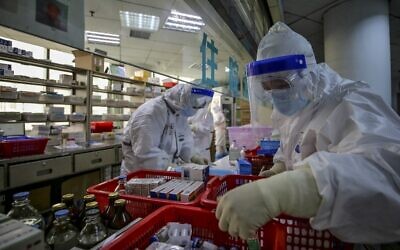 Illustrative: Medical staff arrange medicine at Red Cross Hospital in Wuhan in China's central Hubei province on March 10, 2020. (STR/AFP)
