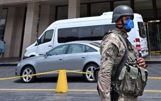 A Peruvian army soldier patrols close to a hotel in Lima on March 16, 2020, one day after President Martin Vizcarra announced a State of Emergency and a two-week nationwide home-stay quarantine together with the closure of all borders to fight the spread of the novel coronavirus. (Photo by Cris Bouroncle / AFP) A Peruvian army soldier patrols close to a hotel in Lima on March 16, 2020, one day after President Martin Vizcarra announced a State of Emergency and a two-week nationwide home-stay quarantine together with the closure of all borders to fight the spread of the novel coronavirus. (Photo by Cris Bouroncle / AFP)