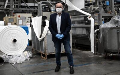 Factory director Fabrizio Sacco poses at the Miroglio masks factory on March 17, 2020 in Govone, near Cuneo, Northwestern Italy.(MARCO BERTORELLO / AFP) Factory director Fabrizio Sacco poses at the Miroglio masks factory on March 17, 2020 in Govone, near Cuneo, Northwestern Italy.(MARCO BERTORELLO / AFP)