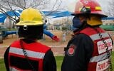 A firefighter sprays disinfectant in a children's playground in the city of Modiin on March 17, 2020, after Israel barred residents from leaving home for "non-essential" reasons and stopped nighttime public transportation, tightening already strict measures to fight the spread of coronavirus. (GIL COHEN-MAGEN / AFP)